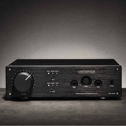 Front view of Violectric HPA V340 Headphone Amplifier on grey concrete surface