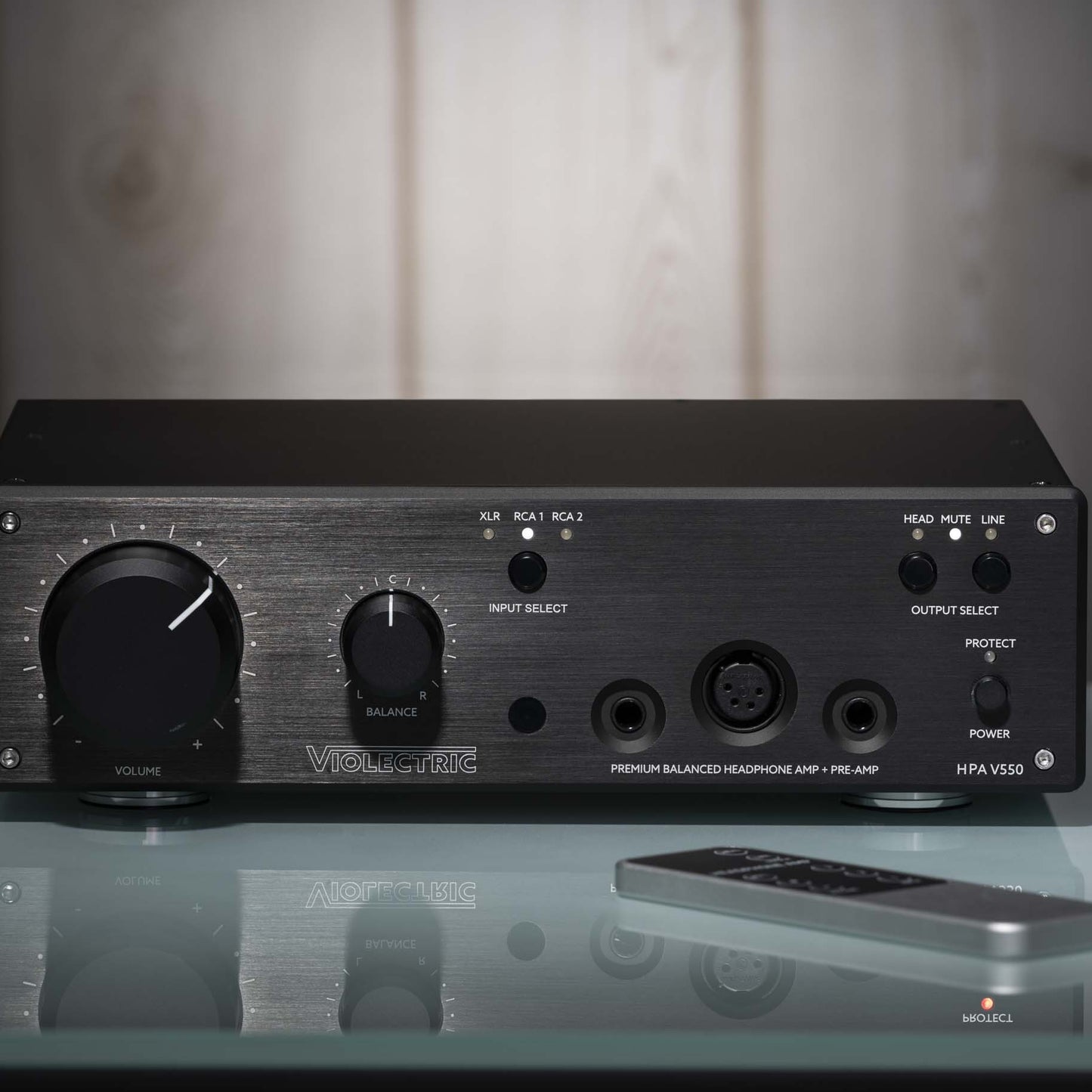 Front view of Violectric HPA V550 Headphone Amplifier on glass surface