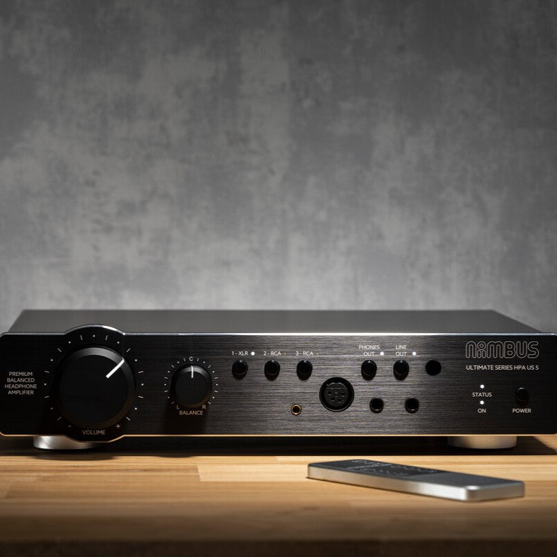 Front view of Violectric Niimbus US 5 Headphone Amplifier on top of wooden surface