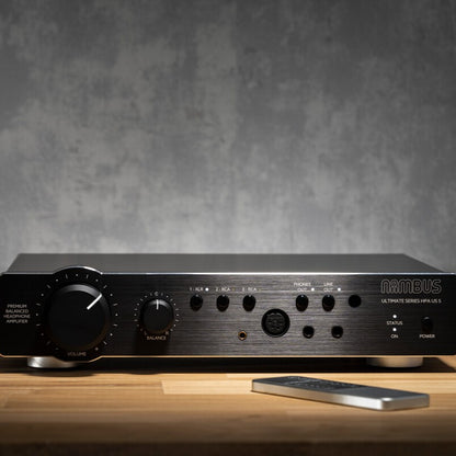 Front view of Violectric Niimbus US 5 Headphone Amplifier on top of wooden surface
