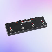 Angled front view of Voodoo Lab Amp Selector PRO Switcher Pedal on purple background
