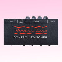 Top view of Voodoo Lab Control Switcher on pink background