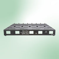 Front view of Voodoo Lab Dingbat PX Pedalboard on green background