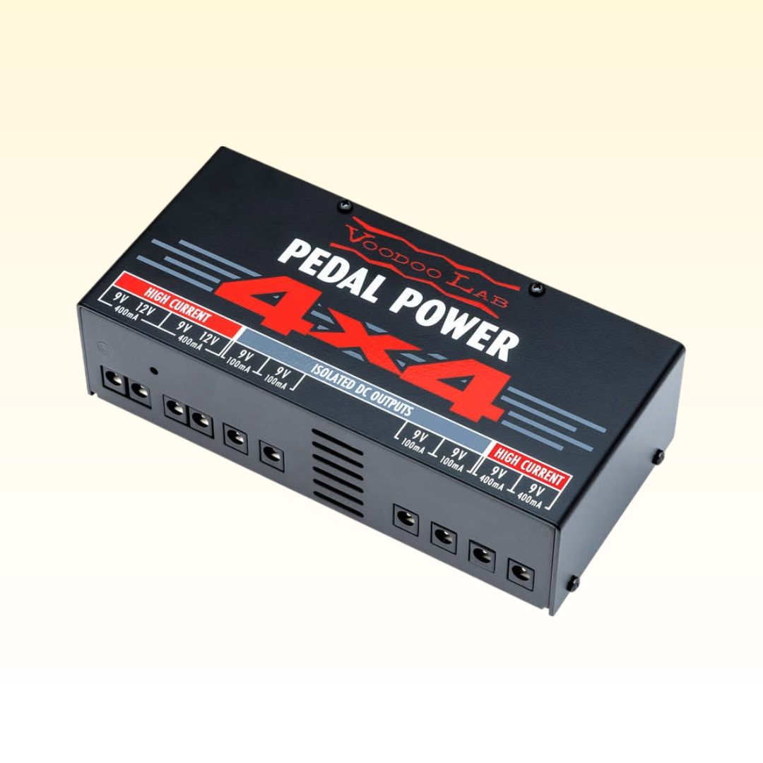 Angled view of Voodoo Lab Pedal Power 4x4 on yellow background