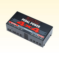 Angled view of Voodoo Lab Pedal Power 4x4 on yellow background