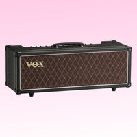Angled front view of Vox AC30 Custom Tube Amplifier Head on pink background