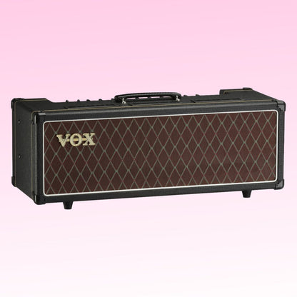 Angled front view of Vox AC30 Custom Tube Amplifier Head on pink background