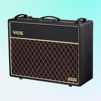Angled front view of Vox AC30 Hand-Wired Greenback Guitar Amplifier on blue background