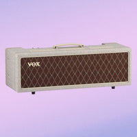 Angled front view of Vox AC30 Hand-Wired Guitar Amplifier Head on purple gradient background