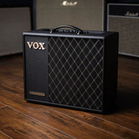 Angled front view of Vox VT40X Modeling Electric Guitar Amplifier on wooden floor with amplifiers in the background