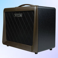 Angled view of Vox VX50AG Acoustic Guitar Amplifier on blue background