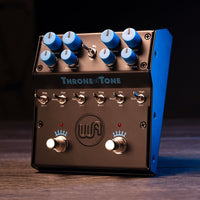 Angled front view of Warm Audio Throne of Tone Dual Overdrive Pedal on wooden surface with dark background