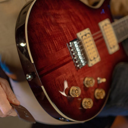 Close up view of Washburn American Hawk '78 Electric Guitar (Vintage Sunburst) on guitarist