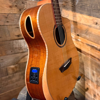 Close up angled view of Washburn BTSC40SCE Bella Tono Suprema Acoustic Electric Guitar on wooden background