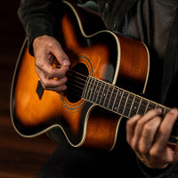 Close up view of Washburn Festival Series EA15 Tobacco Burst being played with studio background