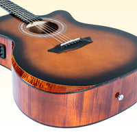 Close up angled view of Washburn G110CE on yellow background