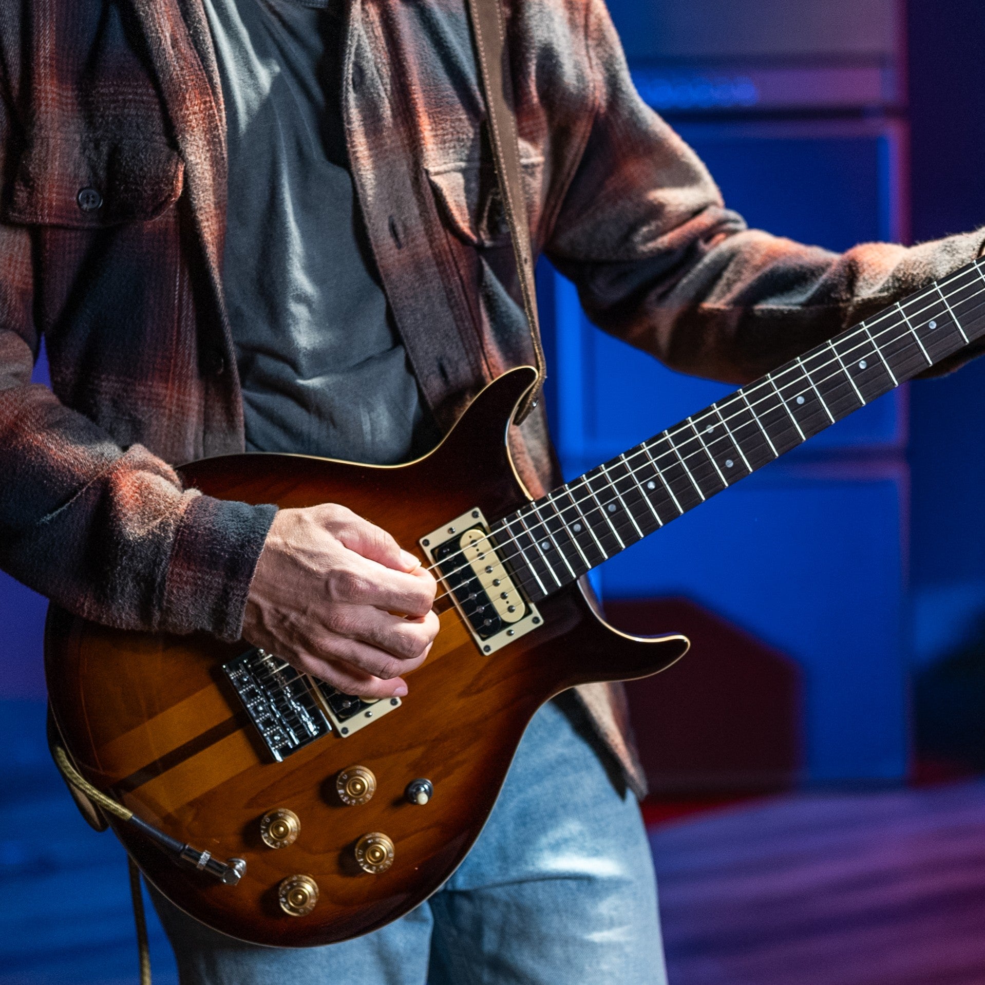 Guitarist playing the Washburn Hawk Electric Guitar Tobacco Sunburst in studio