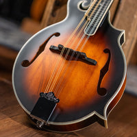 Close up shot of Washburn M3SE on wooden floor with studio background