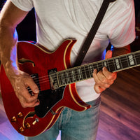 Guitarist playing the Washburn SH35 Semi-Hollow Electric Guitar Trans Red in studio
