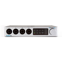 Audio interface with four black circular ports and control panel on a white background