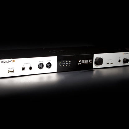 Angled front view of iConnectivity PlayAUDIO1U Dual USB-C Playback Audio/MIDI Interface on dark surface