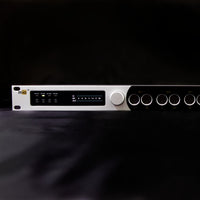 Close up front view of iConnectivity mioXL MIDI Interface on black surface