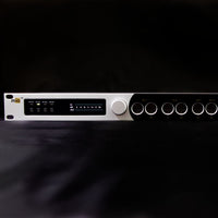 Audio equipment with control knobs and display on a black background